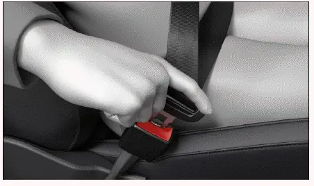 Fig. 1 Insertion du pêne de la ceinture de sécurité dans le